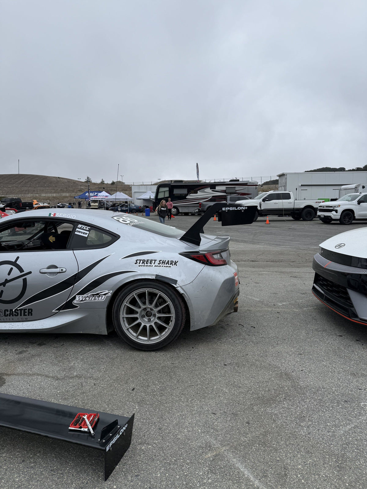GR86 ZN8 with the Epsilon+ TC Wing in the paddock beside a spare wing element