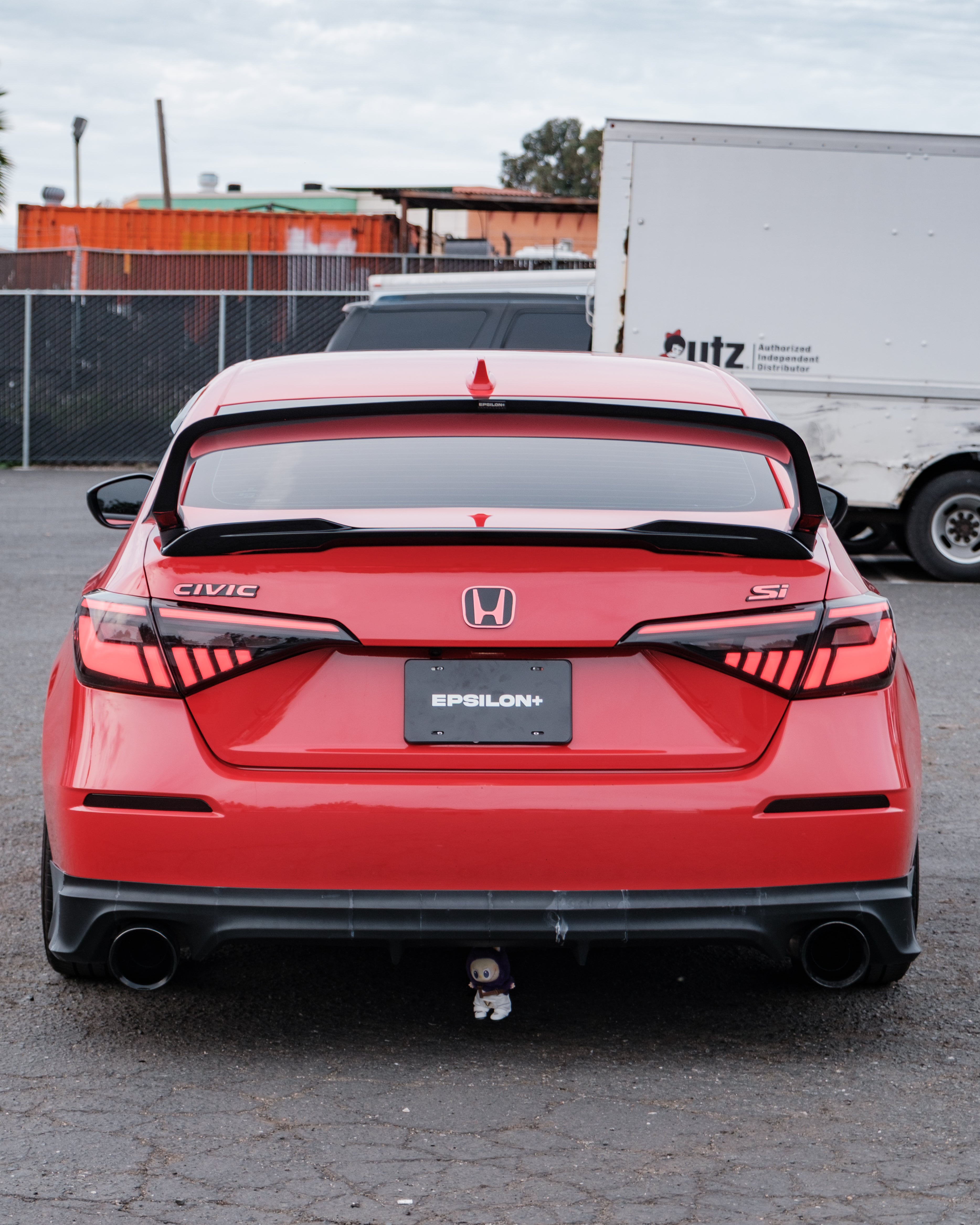 Rear-on view of a red Honda Civic FE with the Epsilon+ aero kit