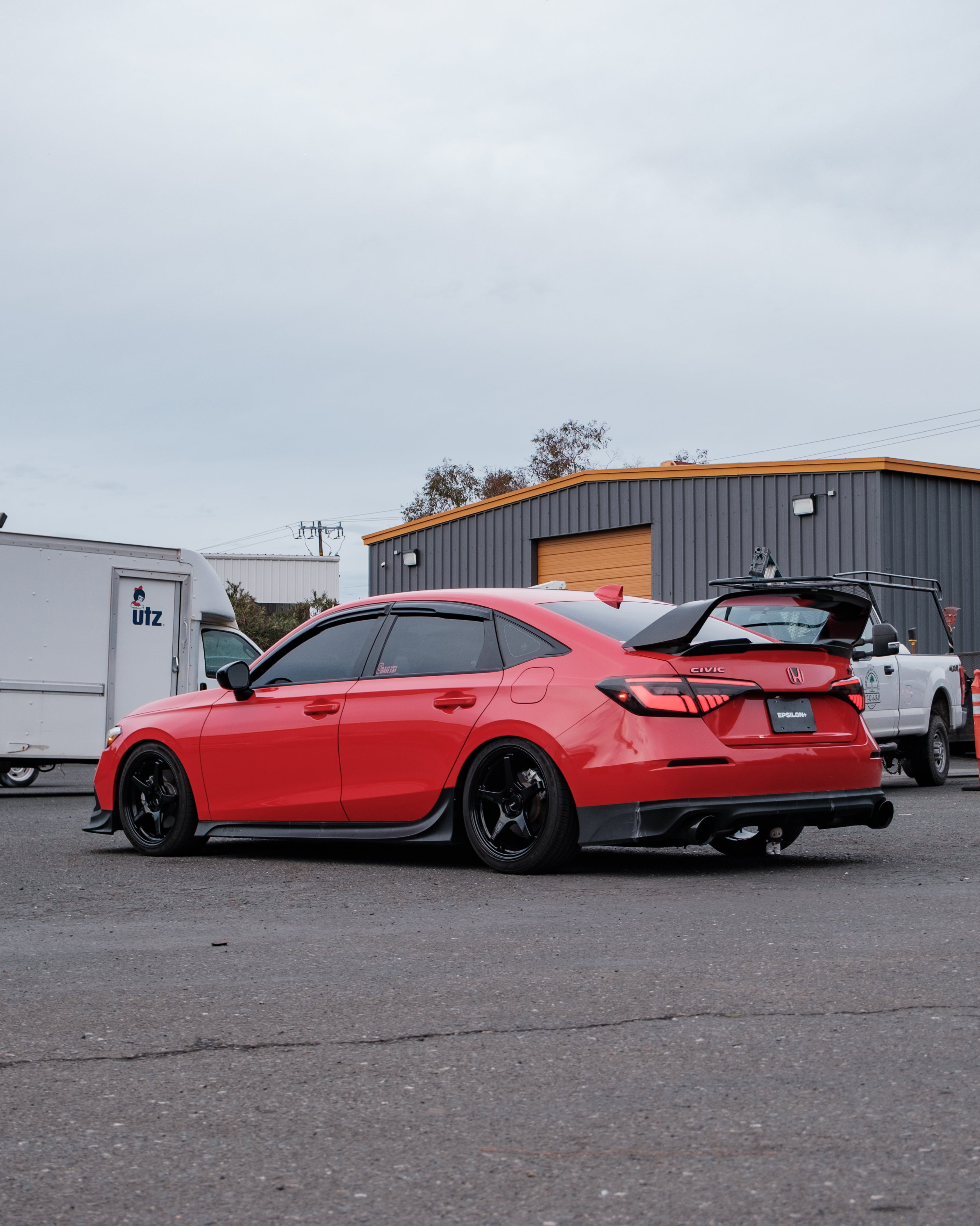 Red Honda Civic FE with the Epsilon+ aero kit, rear three-quarter view
