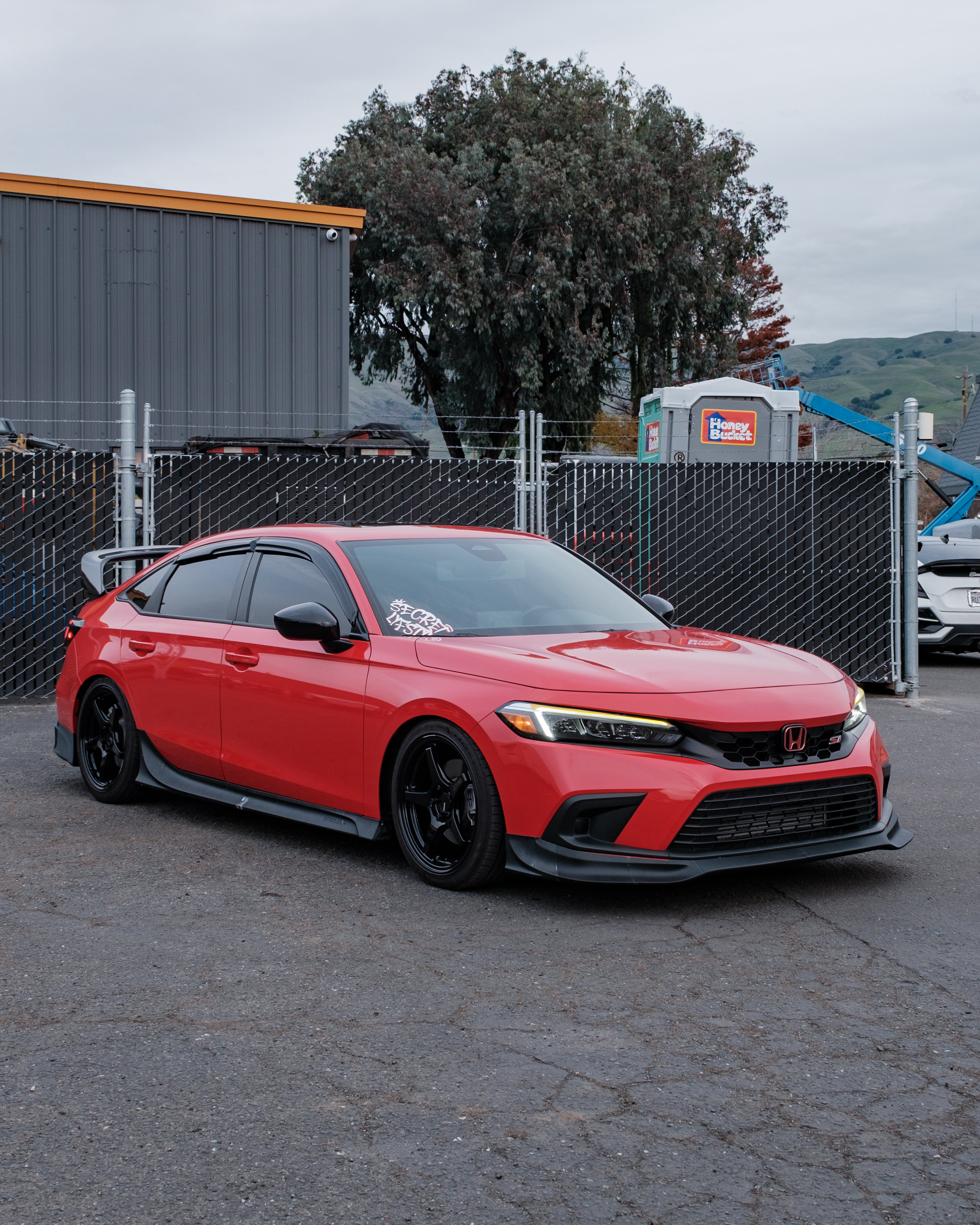 Side profile of a red Honda Civic FE with the Epsilon+ aero kit