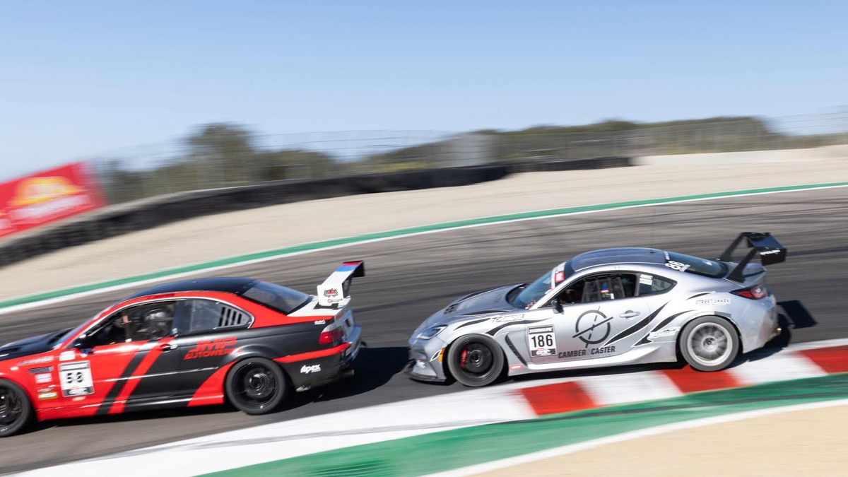 Silver Toyota GR86 ZN8 race car #186 with the Epsilon+ TC wing, cornering on track