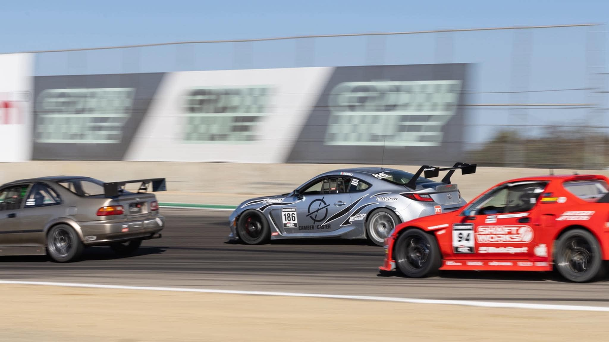Silver Toyota GR86 ZN8 race car with the Epsilon+ TC wing in a pack of cars on track