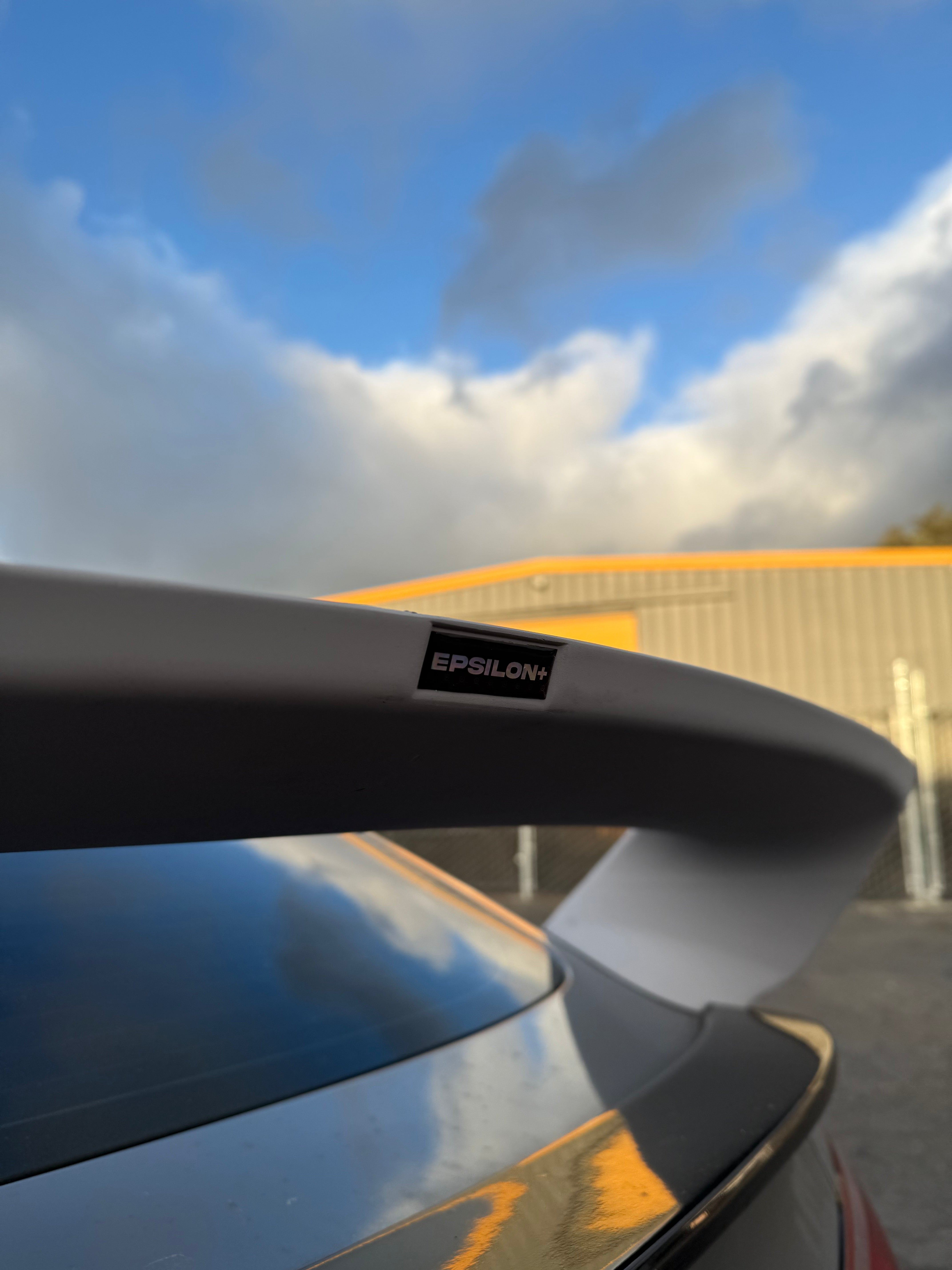 Close-up of the Sport Wing profile on an Acura Integra against the sky