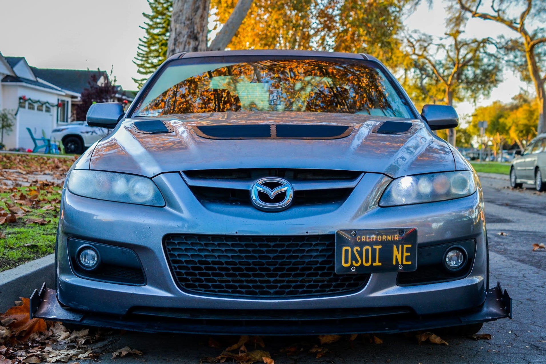 Front-on view of a gray Mazdaspeed6 with front splitter, close-up of Hammerhead extensions