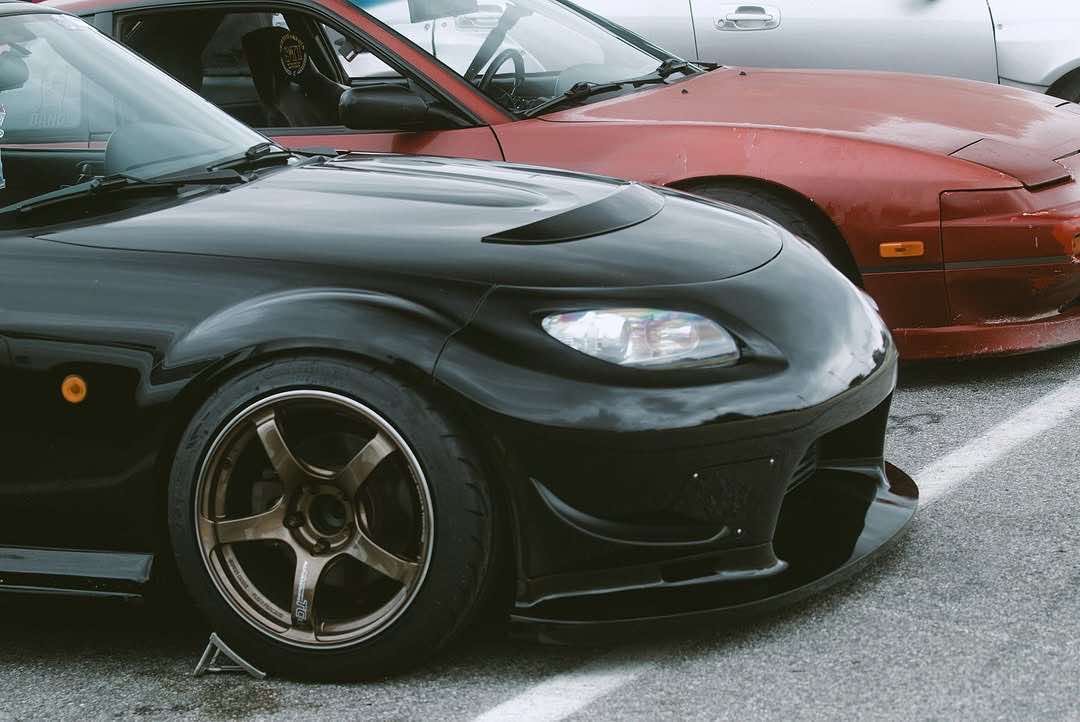 Black Mazda MX-5 Miata NC with the Epsilon+ front bumper and bronze wheels