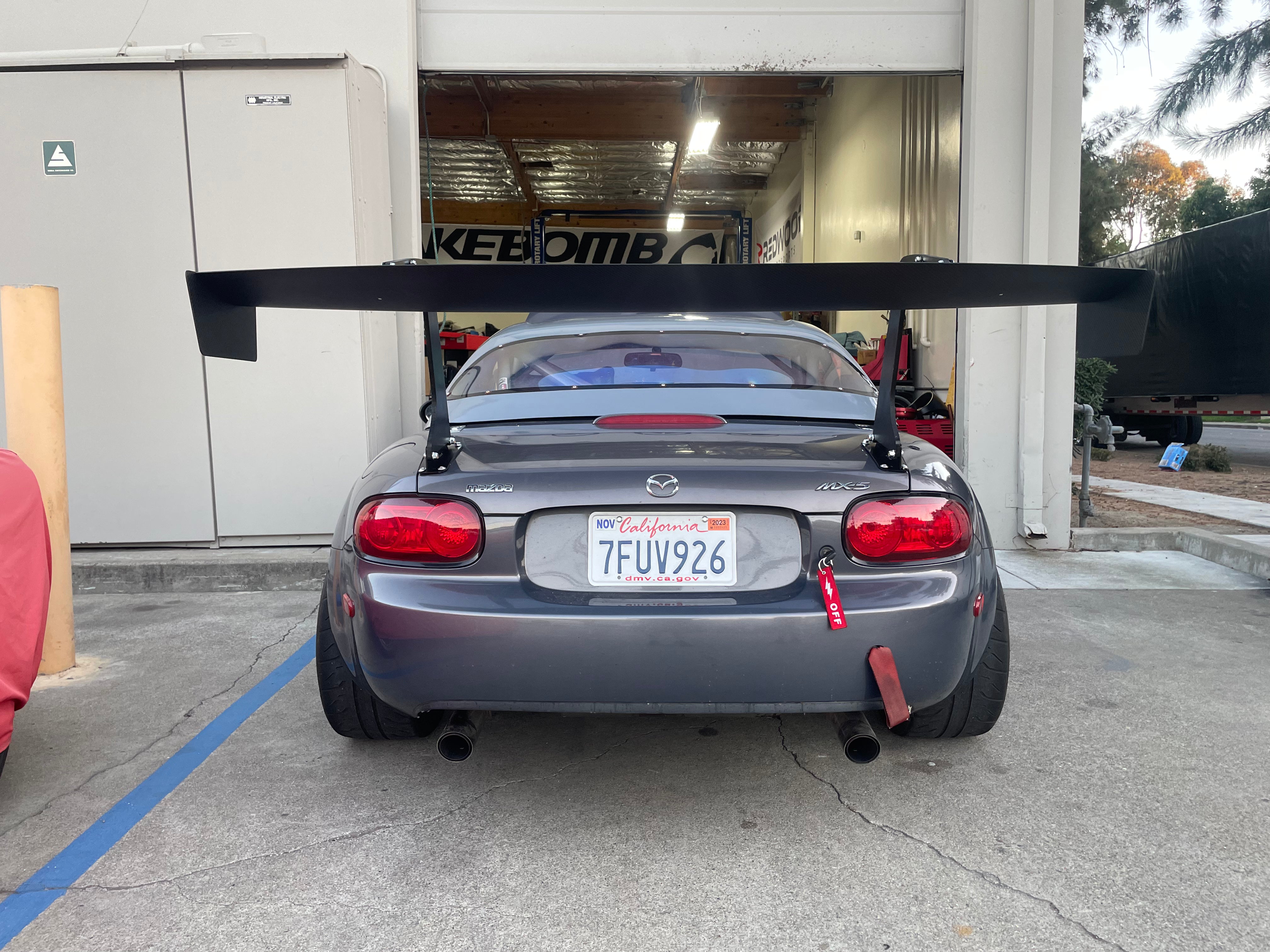 Rear view of a gray Mazda MX-5 Miata NC fitted with the Epsilon+ GT wing