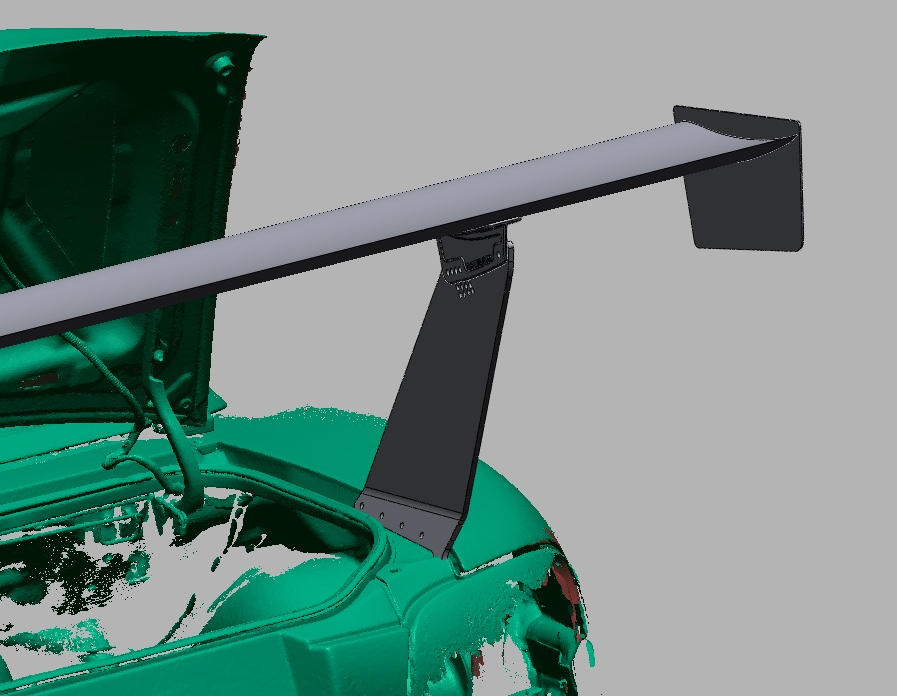 Quarter-panel mount bracket bolting the TC Wing upright to the NB Miata body, trunk open