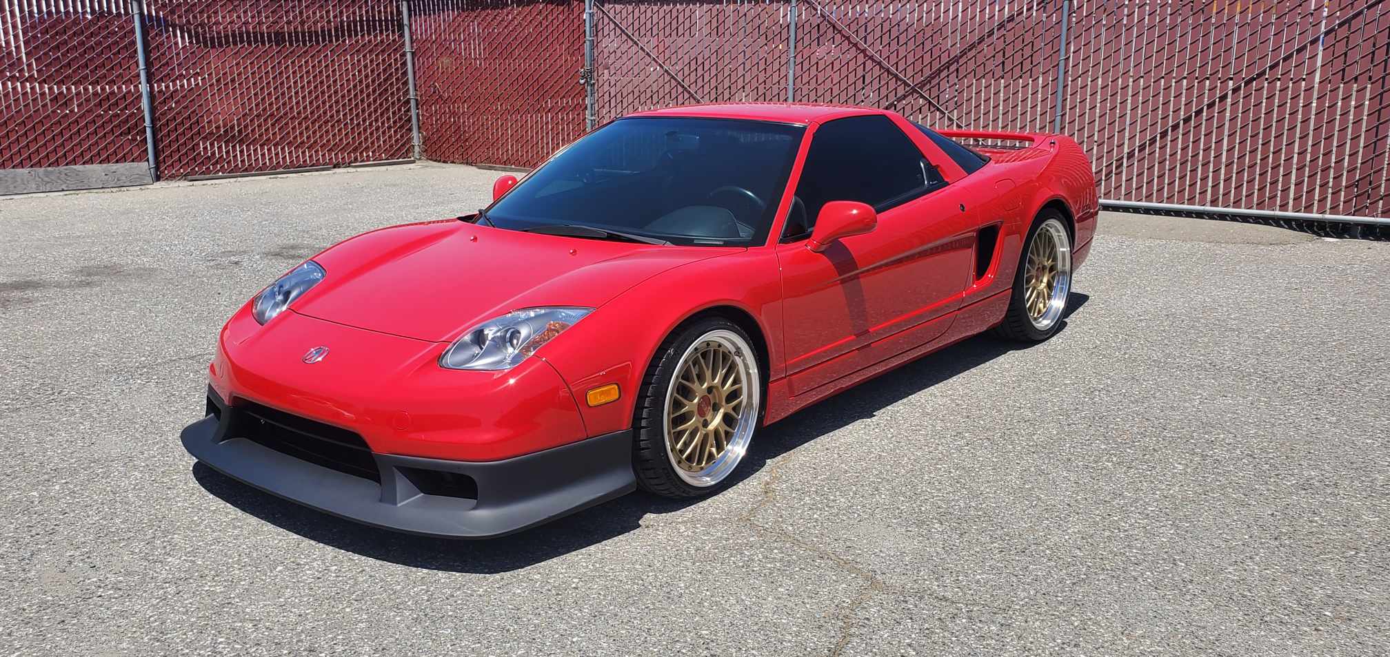 Red Acura NSX NA2 with R-GT front lip parked outdoors