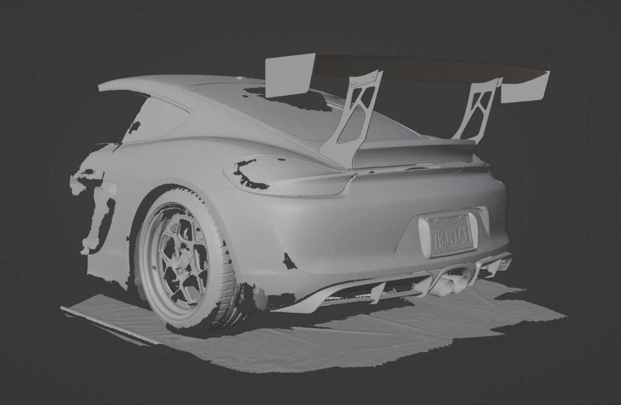 3D scan render of a Porsche Cayman rear three-quarter view with GT wing fitment