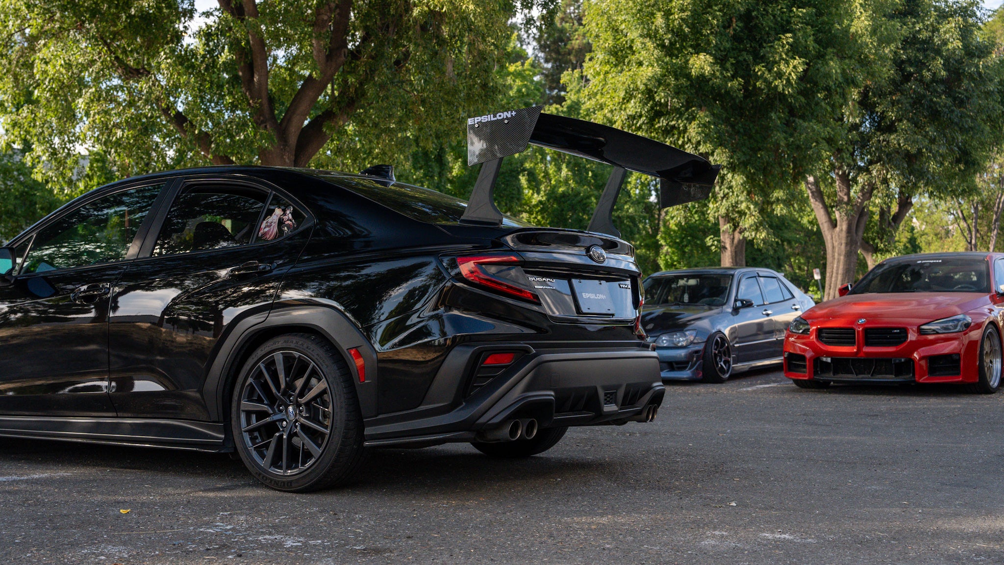 Black Subaru WRX VB with the Epsilon+ GT wing, rear three-quarter view