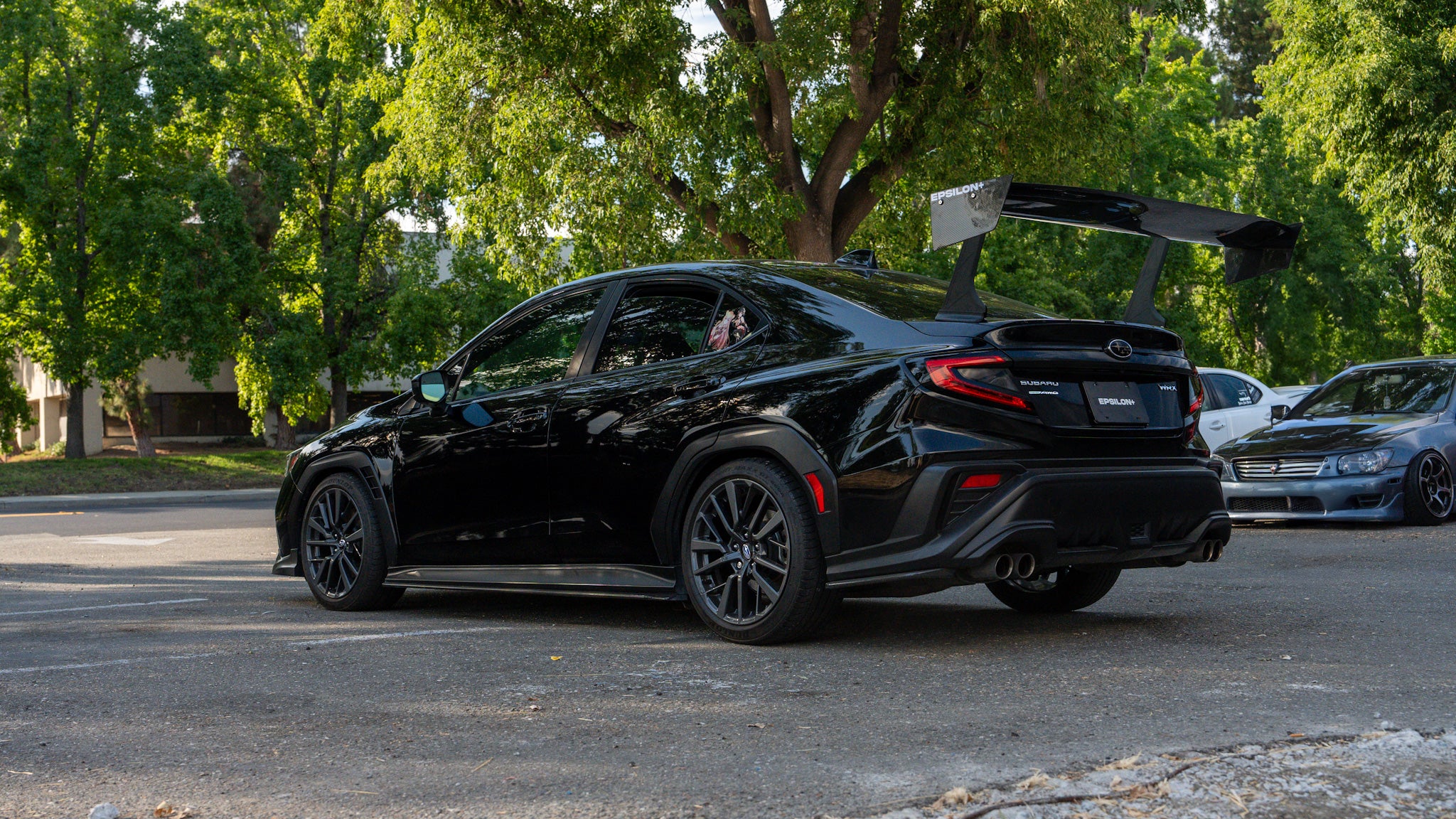 Side-rear view of a black Subaru WRX VB with the Epsilon+ GT wing