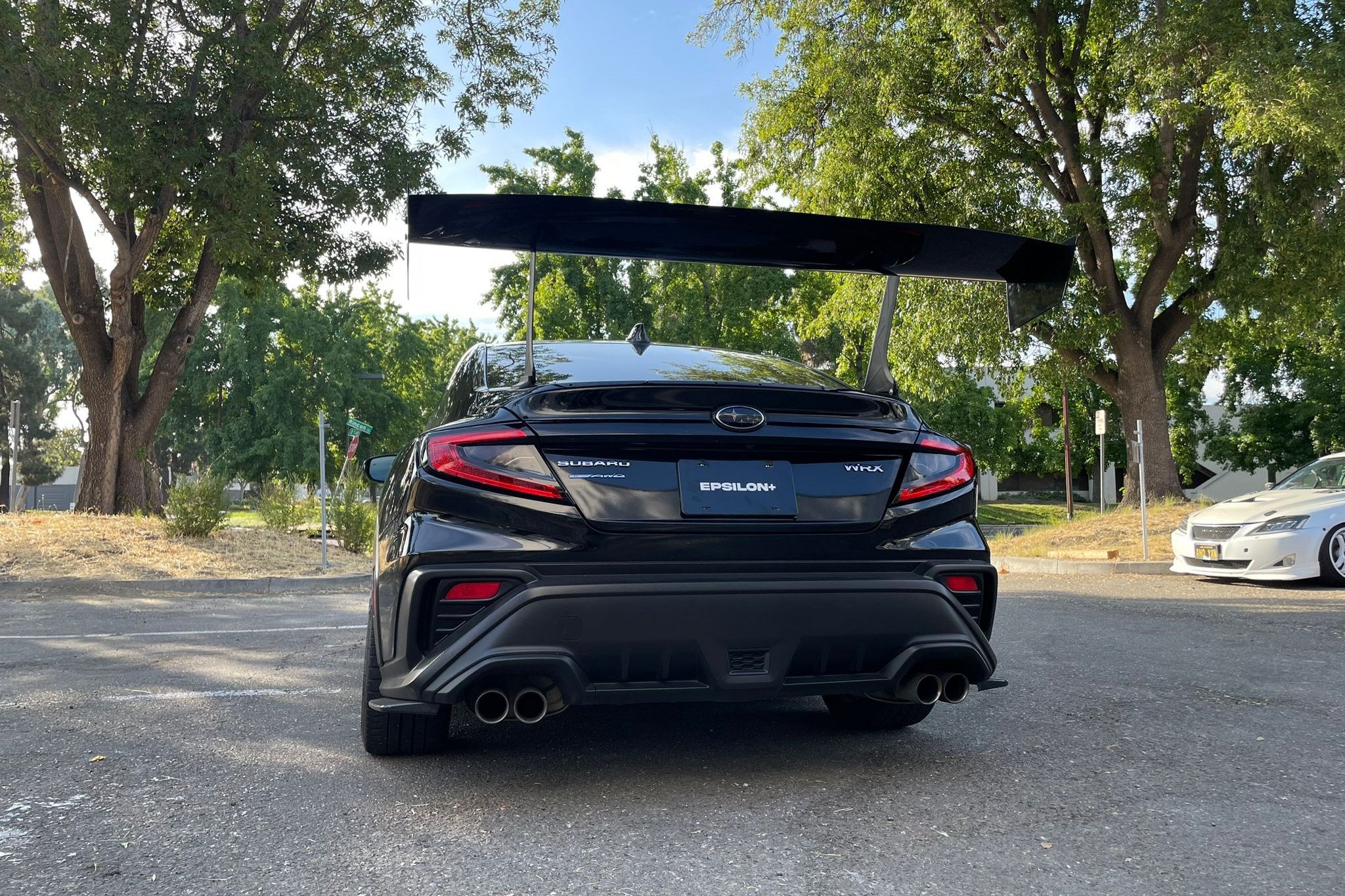 Rear view of a black Subaru WRX VB showing the full width of the GT wing