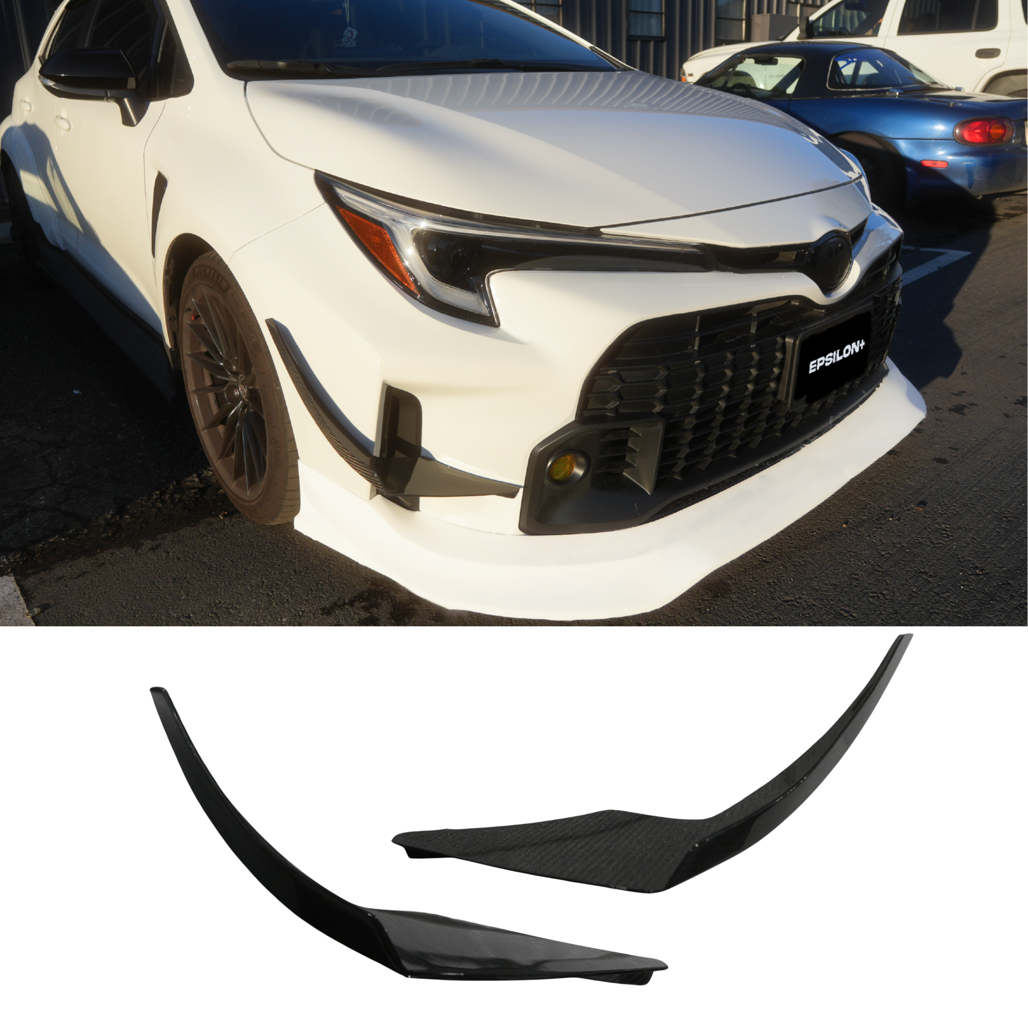 Front three-quarter view of a white GR Corolla with canards on the front bumper