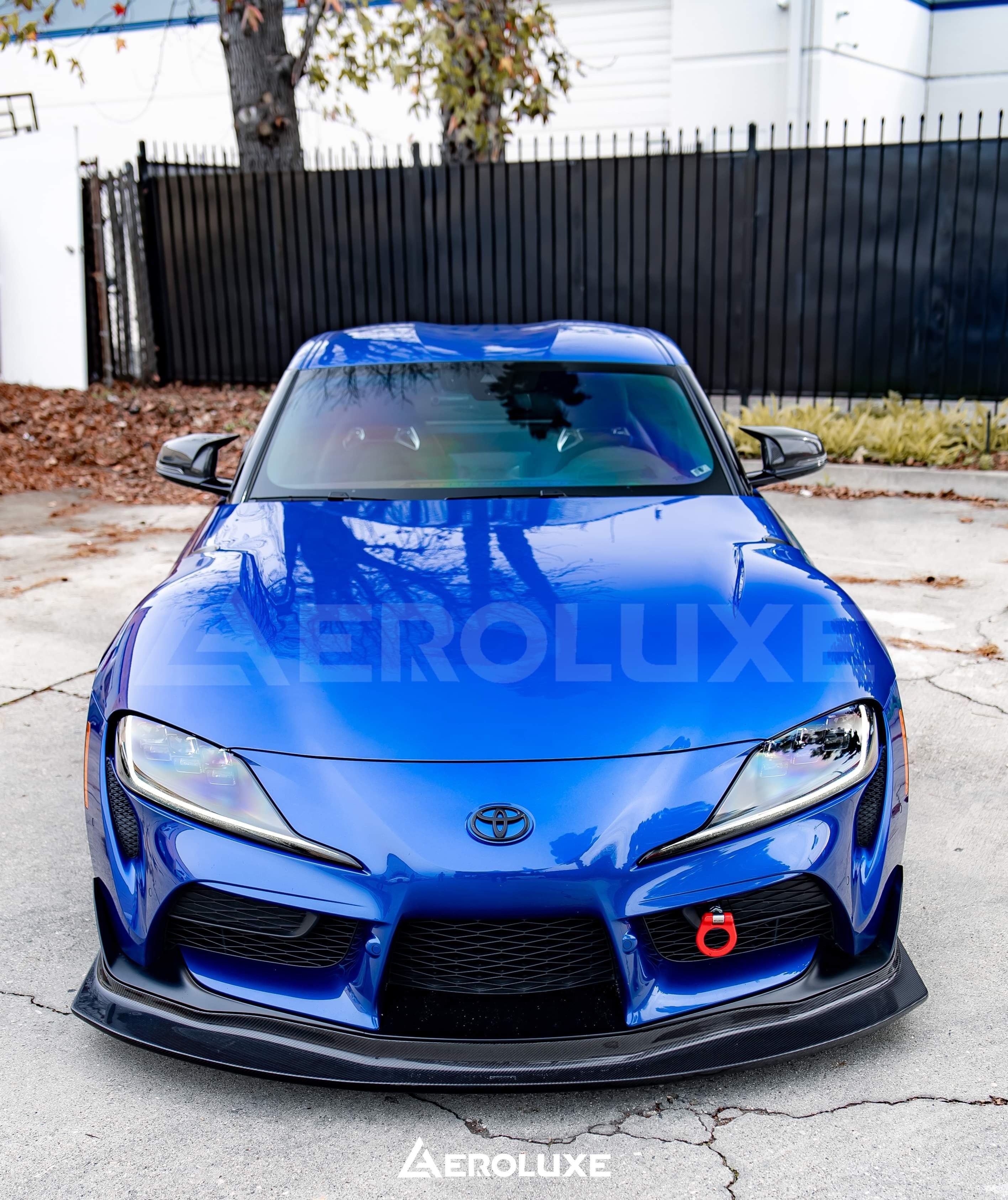 Blue Toyota GR Supra with the GT4-spec front lip, front three-quarter view