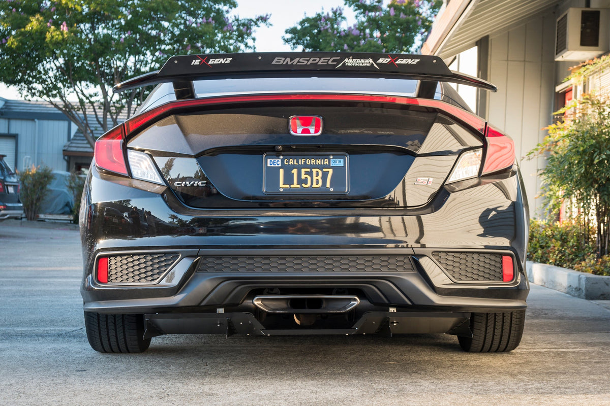 Rear-on view of a black Civic Hatchback with the universal center-exit diffuser