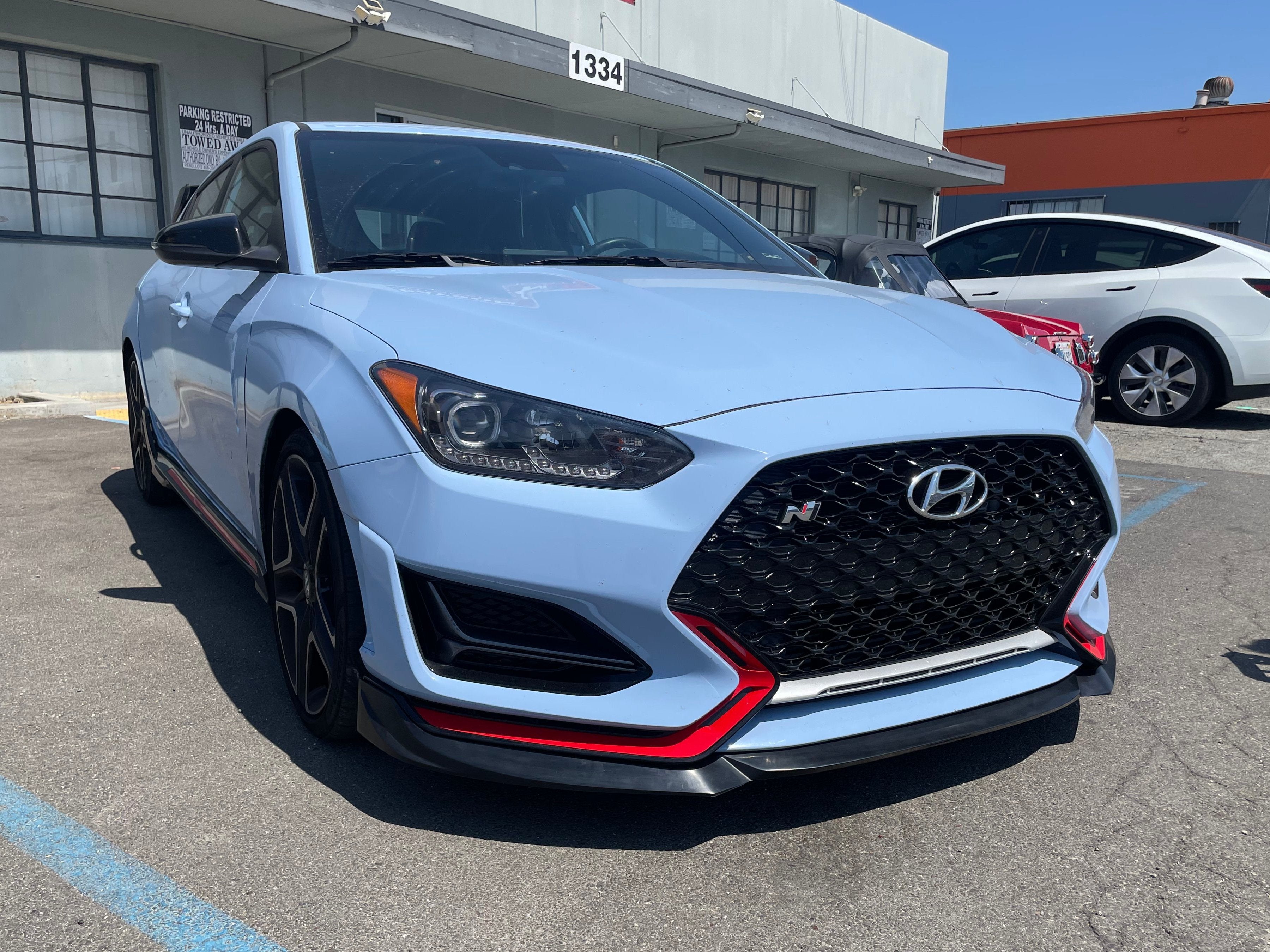 Close front three-quarter view of the front lip on a Hyundai Veloster N