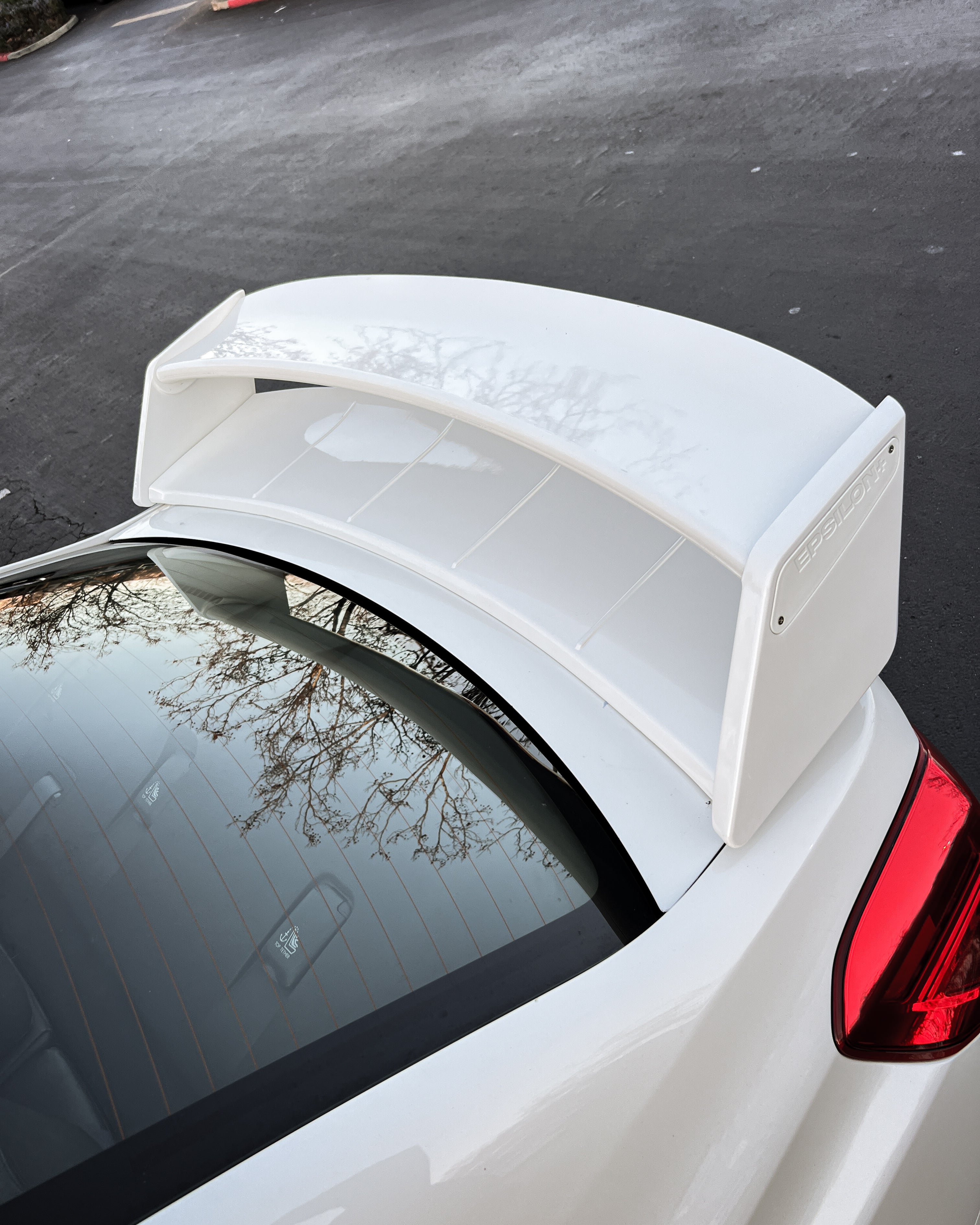 Close view of the WRC wing above the rear glass on a white Subaru WRX VA