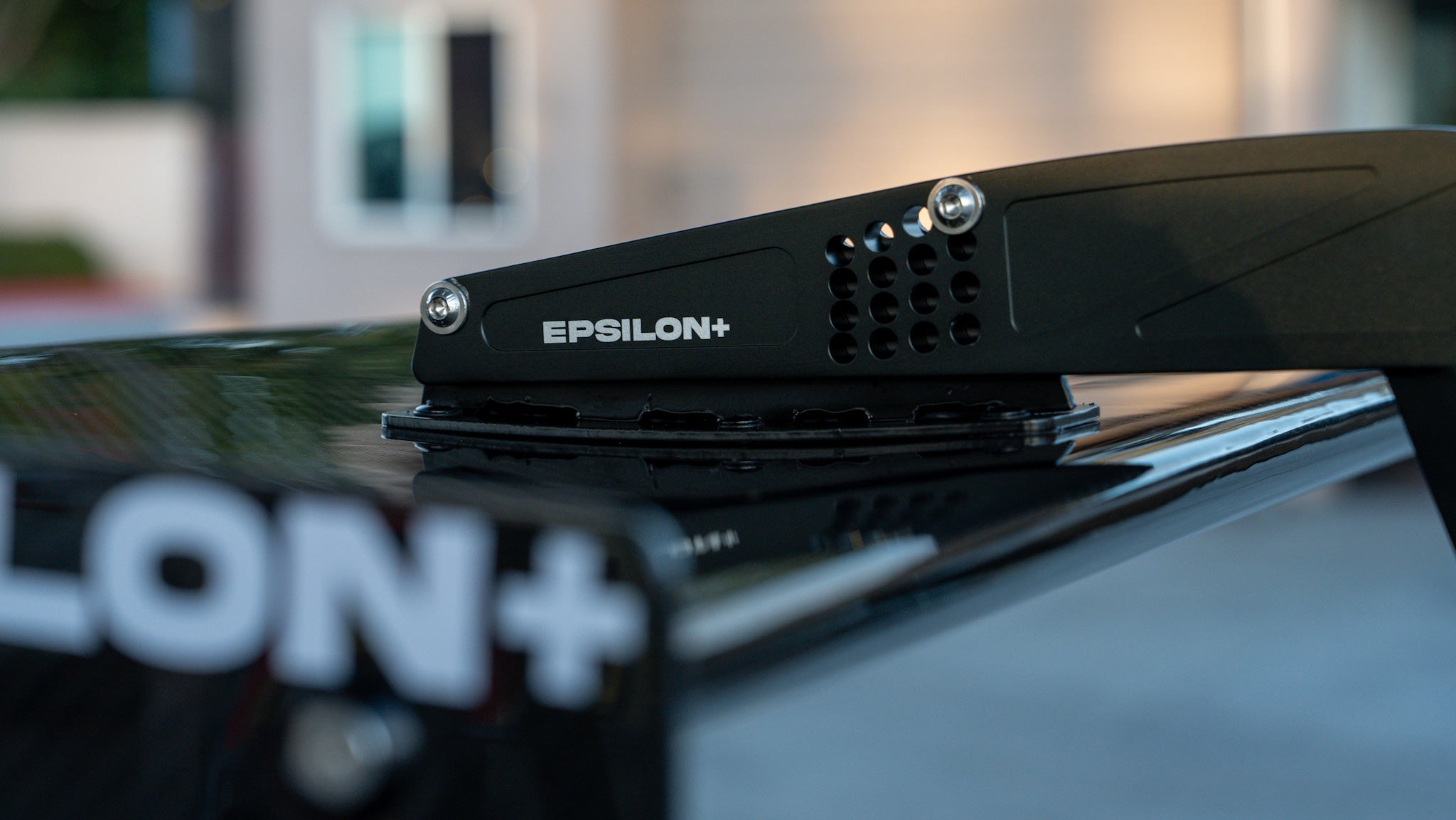 Close-up of the GT wing riser and Epsilon+ branding on a Subaru WRX VB