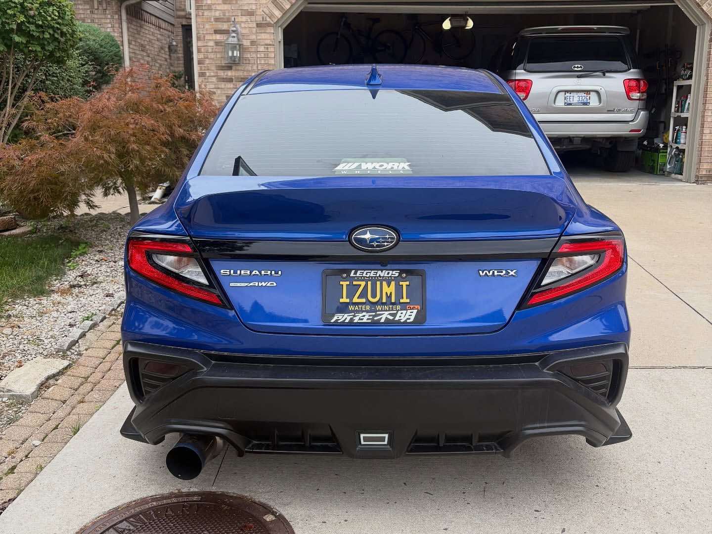 Rear view of a blue Subaru WRX VB fitted with the rear duckbill spoiler