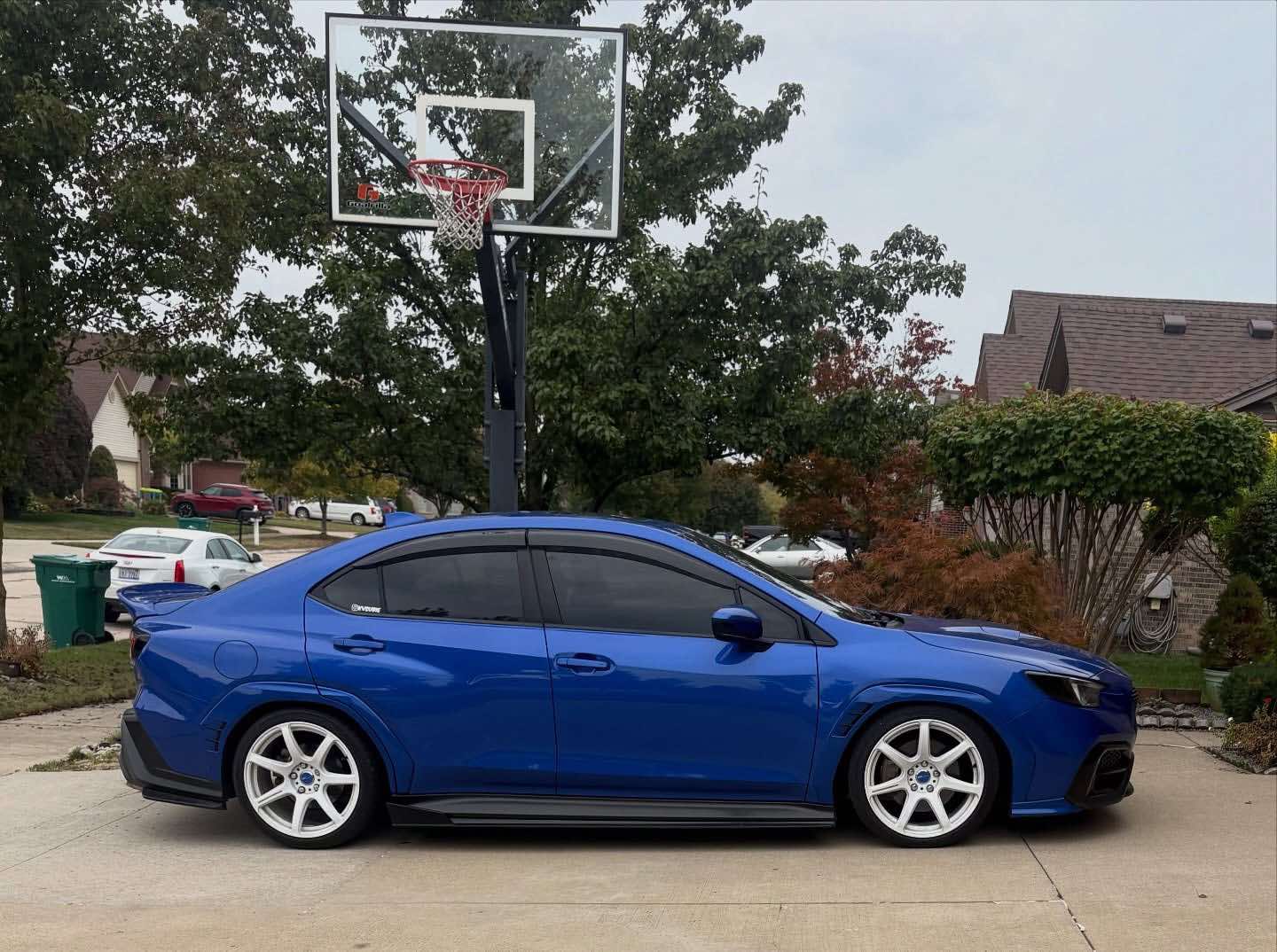 Side profile of a blue Subaru WRX VB showing the rear duckbill spoiler line