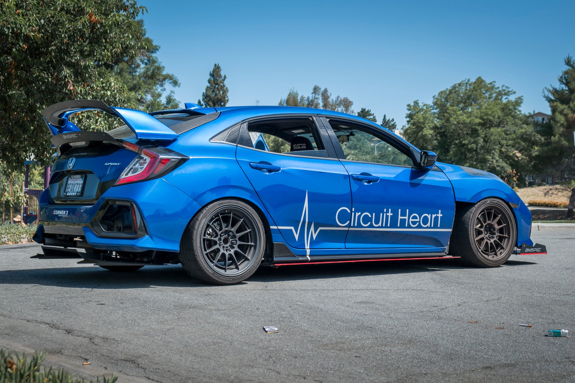 Blue Civic Hatchback FK7 with Circuit Heart livery and V1C+ diffuser, rear three-quarter view