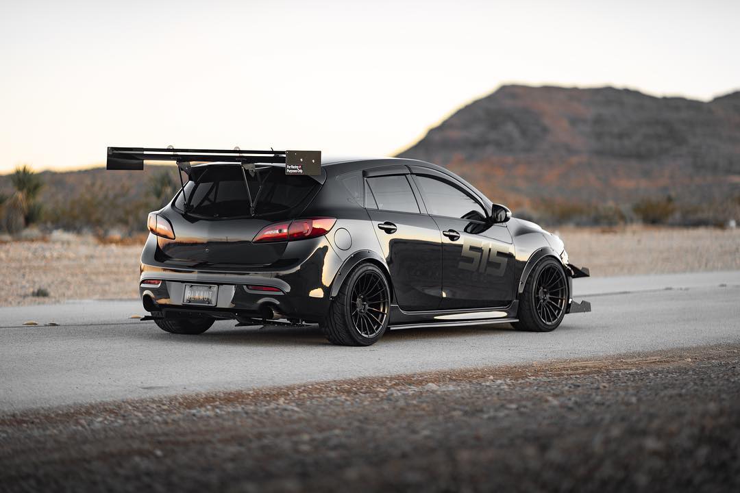 Black Mazdaspeed3 Gen2 with V1+ diffuser and GT wing on a desert road